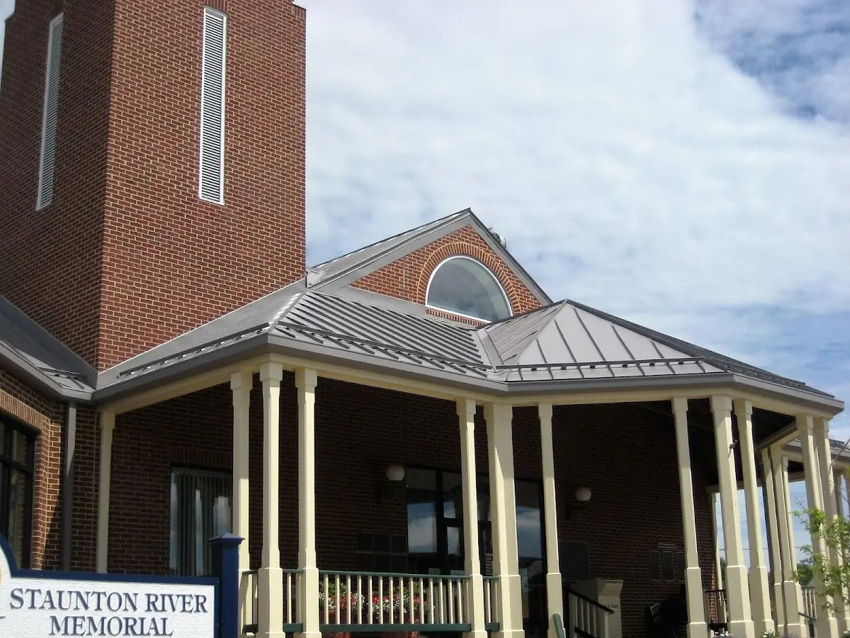 Skilled roofing craftsmen working on a residential roof in Merrimac